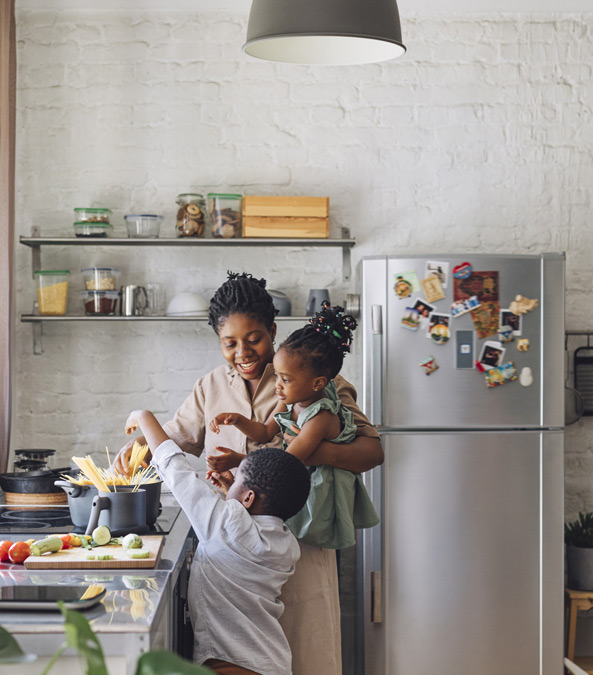 home_electronics_page_image Family cooking in kitchen